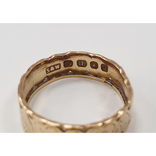 308 - 18ct gold wedding band with pierced and engraved heart decoration, size K, approx. 2.8g