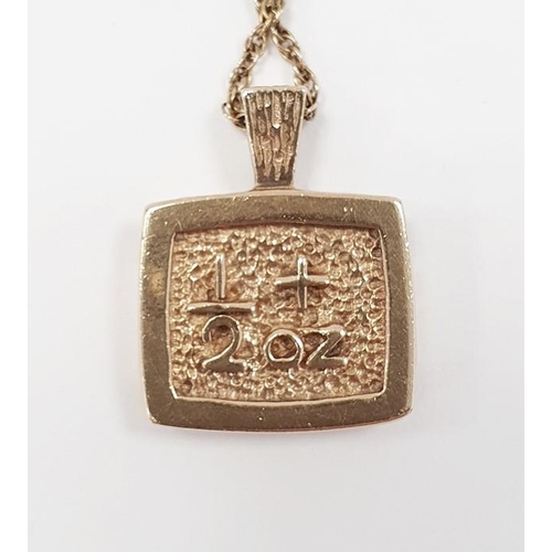 313 - 9ct gold pendant modelled as a half-ounce ingot on a gold coloured chain, total weight approx. 21g