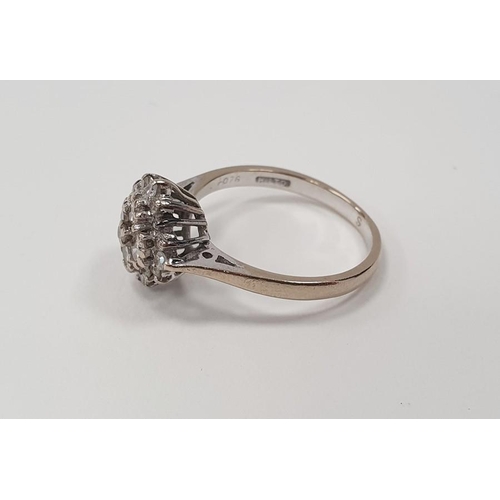 316 - 18ct white gold diamond cluster ring set with four brilliant cut diamonds within a border of further... 