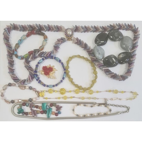 317 - Quantity of costume jewellery including a yellow faceted bead necklace, a snake-link necklace, etc.