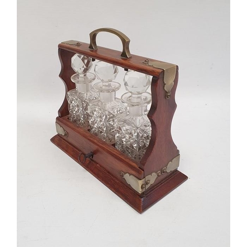 347 - Miniature tantalus, the oak frame with silver plated mounts and handle and fitted with three cut gla... 