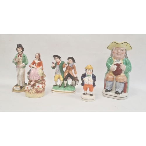 57 - Collection of Staffordshire pottery figures, circa 1880, including a Toby jug, 24cm high overall, a ... 