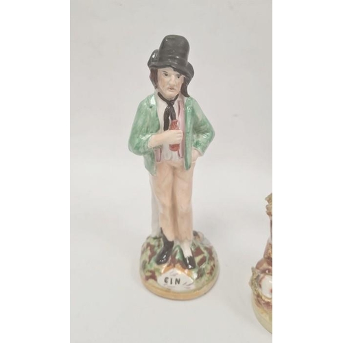 57 - Collection of Staffordshire pottery figures, circa 1880, including a Toby jug, 24cm high overall, a ... 