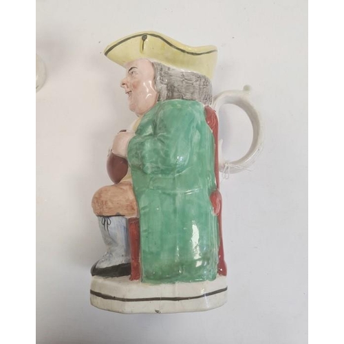 57 - Collection of Staffordshire pottery figures, circa 1880, including a Toby jug, 24cm high overall, a ... 