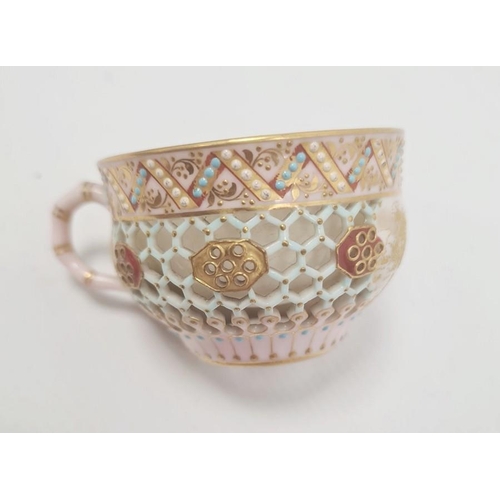 80 - Royal Worcester porcelain reticulated cabinet cup and saucer with gilt landscape and jewelled decora... 