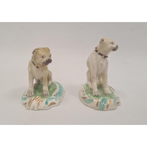 89 - Two various early 19th century Staffordshire china miniature seated pug dogs, the largest 6.5cm high... 