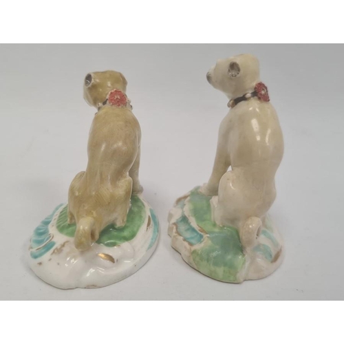 89 - Two various early 19th century Staffordshire china miniature seated pug dogs, the largest 6.5cm high... 