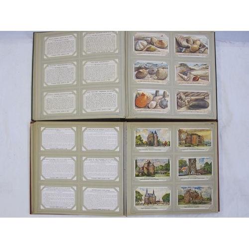 216 - Two albums of trade cards 'Chromos Liebig Chromo's' including 'De Koppoortigen', 'De Kalevala', 'De ... 