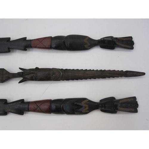 239 - Pair of African carved ceremonial figure heads spears and another larger (3)