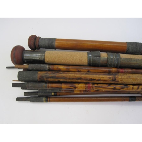 272 - Various cane and other fishing rods, a reel and a net