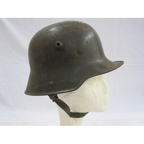 370 - WWI German M16 helmet with leather liner and chin strap