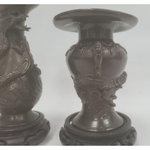 104 - Two Japanese Meiji period bronze vases, the first baluster shaped, 15.5cm high and the second of inv... 