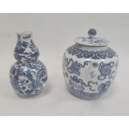 105 - Chinese porcelain teapot, bulbous and decorated in blue with precious objects, 11cm high (repaired t... 