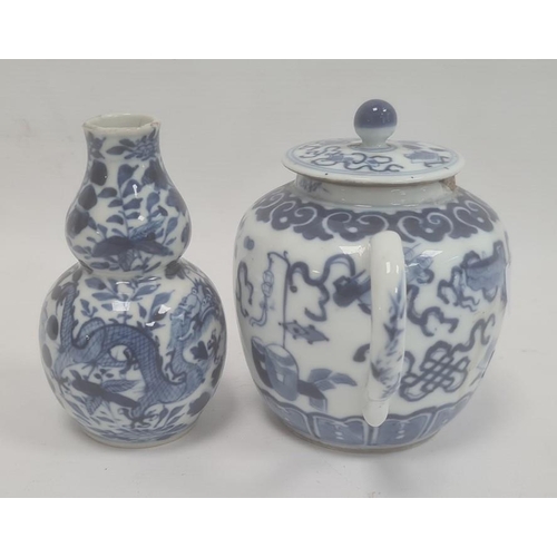 105 - Chinese porcelain teapot, bulbous and decorated in blue with precious objects, 11cm high (repaired t... 