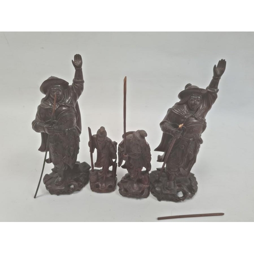 110 - Two various pairs of Japanese carved hardwood figures, the tallest 21cm and a small quantity of carv... 