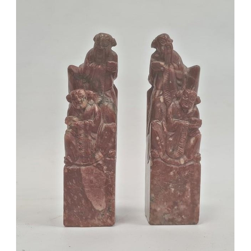 112 - Pair Chinese carved soapstone seals, each surmounted by two male figures, 12cm high