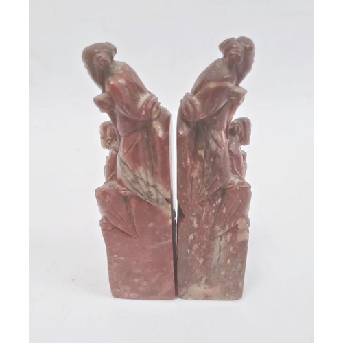 112 - Pair Chinese carved soapstone seals, each surmounted by two male figures, 12cm high