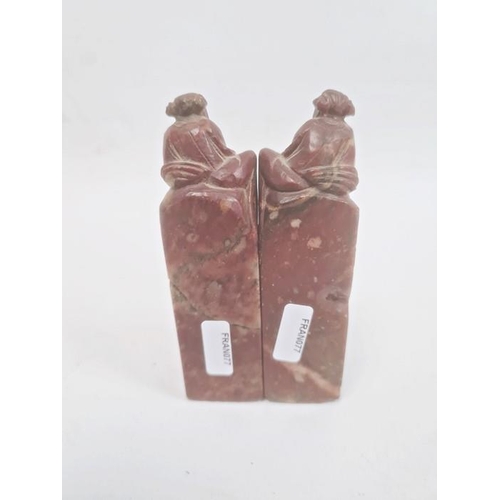 112 - Pair Chinese carved soapstone seals, each surmounted by two male figures, 12cm high