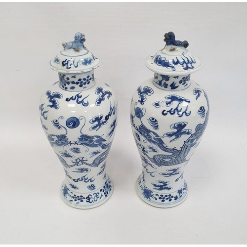 135 - Pair Chinese porcelain vases, each inverse baluster shaped and painted with pair ferocious dragons a... 