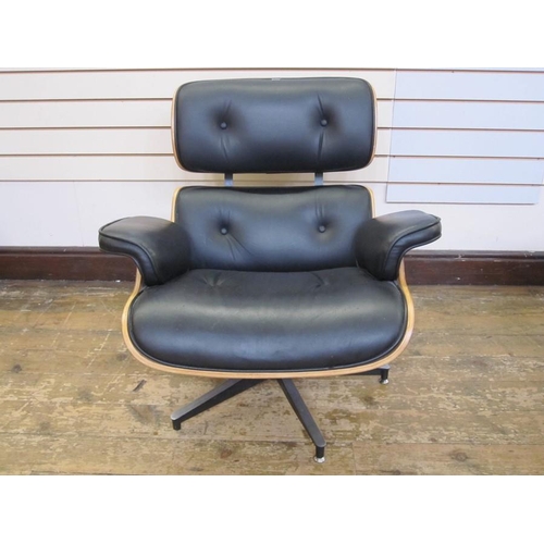 1428 - Reproduction Charles and Ray Eames lounge chair and ottoman, Herman Miller Collection in black leath... 