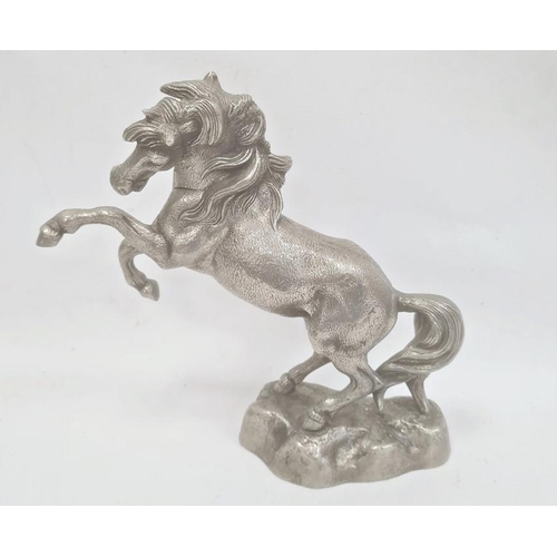 170 - Cast metal model of rearing horse on rocky base, 33cm high