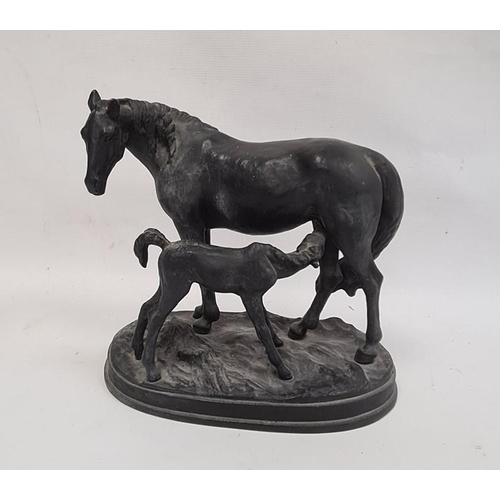 177 - Black painted cast metal group of a mare and foal on oval plinth base, 23cm high