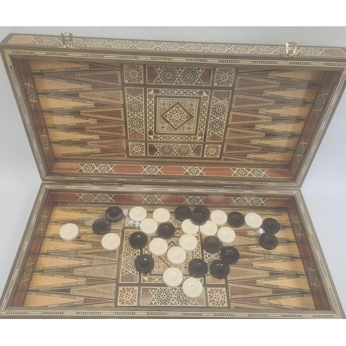 193 - Parquetry inlaid chequerboard games box, hinged with various playing pieces, 51cm wide