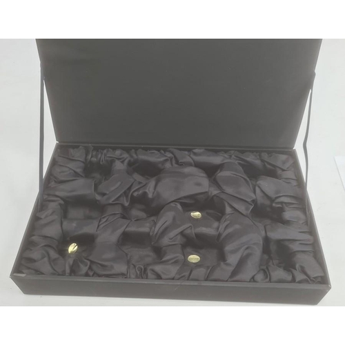 214 - An oriental cased box of twelve hard-stone elephants, to include rose quartz etc