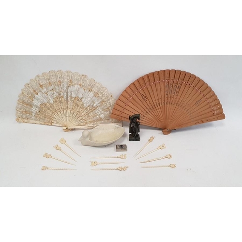 216 - Bone cocktail sticks, Eastern carved stone figure, wooden brise fan, lace and bone fan and a Baxter ... 