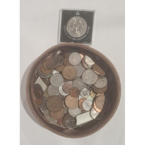 224 - Assorted world coins in a leather case