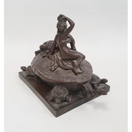 238A - A 19th century bronze inkwell in the form of two nude classical figures seated atop Bixi, a dragon w... 