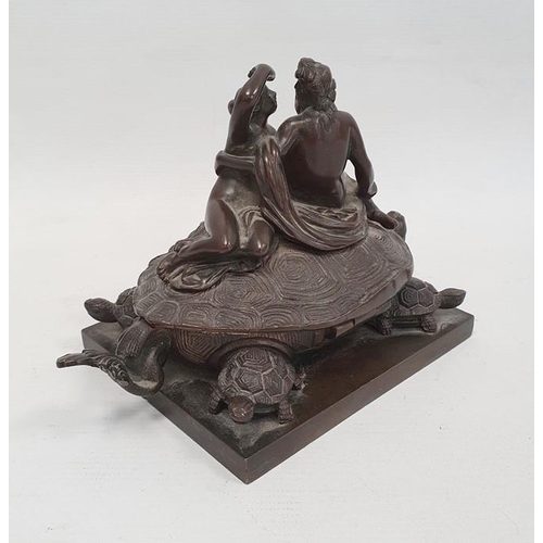 238A - A 19th century bronze inkwell in the form of two nude classical figures seated atop Bixi, a dragon w... 