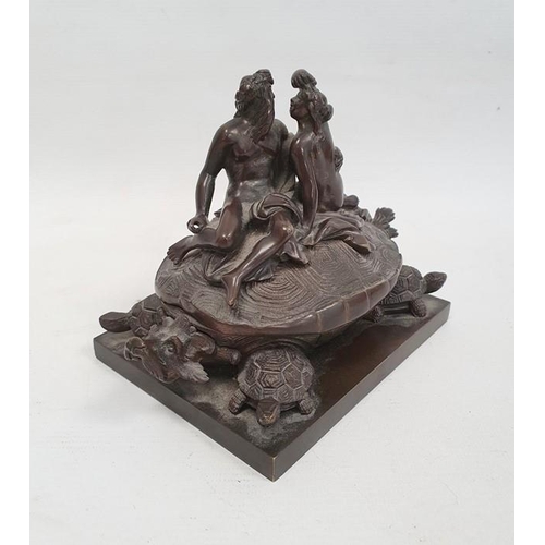 238A - A 19th century bronze inkwell in the form of two nude classical figures seated atop Bixi, a dragon w... 