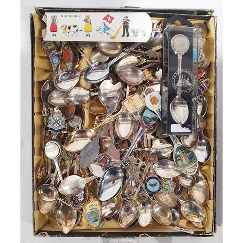 372 - Large quantity of souvenir spoons in two display shelves and a display case and various loose spoons