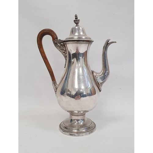 374 - A silver plated coffee pot, wooden handle on a circular base, unmarked, etched V EL to base, 29cm hi... 