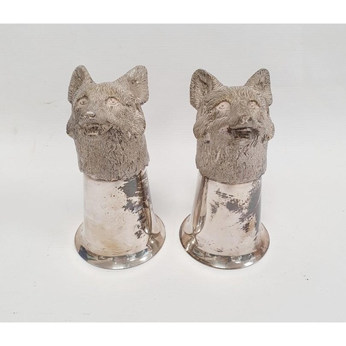 377 - A pair of silver coloured metal fox head stirrup cups, 12cm approx. (2)