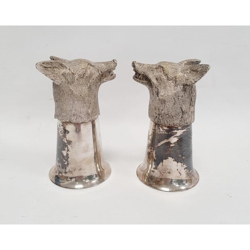 377 - A pair of silver coloured metal fox head stirrup cups, 12cm approx. (2)