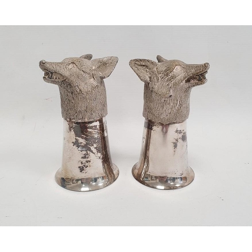 377 - A pair of silver coloured metal fox head stirrup cups, 12cm approx. (2)