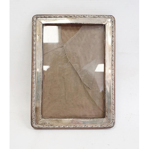 396 - 1940's silver-mounted rectangular picture frame, relief decorated to edge, Birmingham 1944, maker's ... 