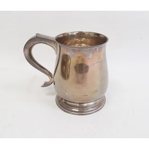 419 - Silver mug by Wakely & Wheeler, London 1936 of plain baluster form, on circular foot with scroll han... 