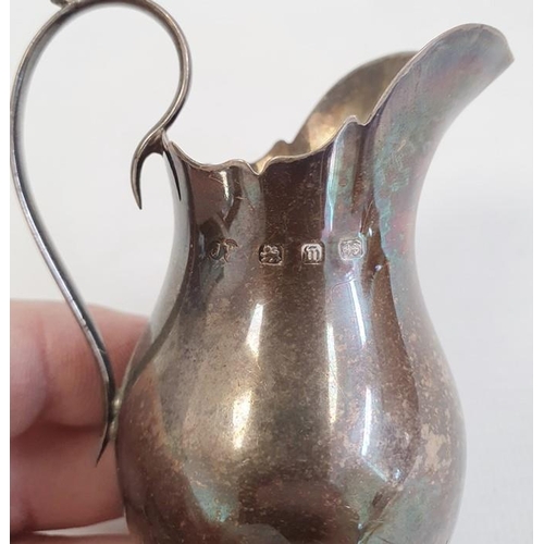 439 - Small silver jug by B Muller & Son, with import marks for Chester 1901, 6.5cm high, another small si... 