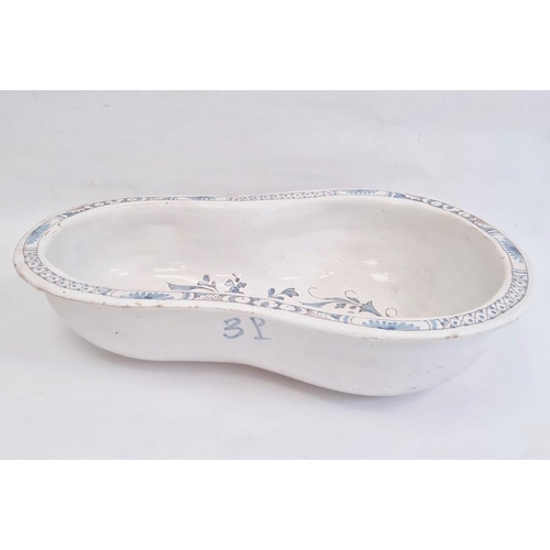 59 - Nineteenth century tin-glazed earthenware bidet bowl in blue and white with floral scrolling decorat... 