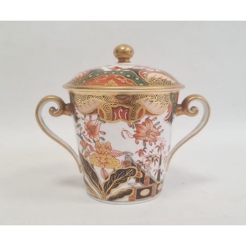 32 - Spode two handled cup and cover, circa. 1820 of tapering form with scroll handles decorated in the I... 