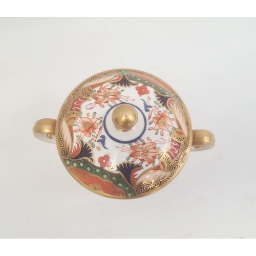 32 - Spode two handled cup and cover, circa. 1820 of tapering form with scroll handles decorated in the I... 