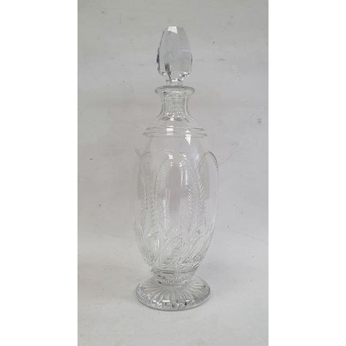 69 - Stuart cut glass decanter, the ovoid body decorated with stylised leaves and fronds, with etched sig... 
