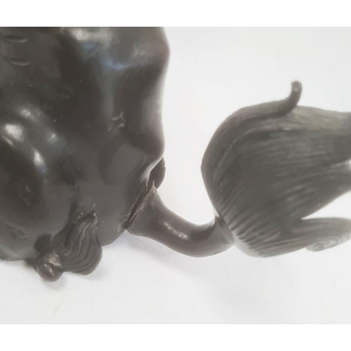 93 - Chinese bronze model of a lion dog seated with pierced ball (with losses), 20cm high