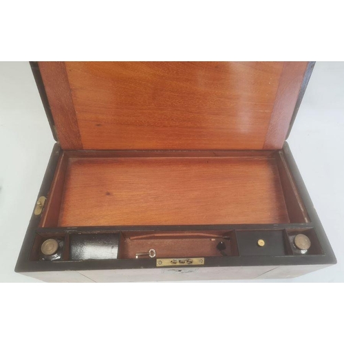 1051 - 19th century walnut and brass bound writing slope with fitted interior and drawer under