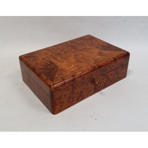 1055 - Modern burrwood box of rectangular form with fitted interior, 26cm long and a pair of matching tea l... 