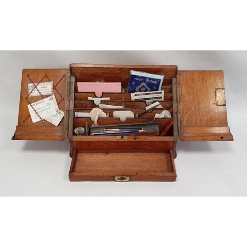 1062 - Late 19th/ early 20th century oak desk tidy the twin doors opening to reveal sectioned interior, ink... 