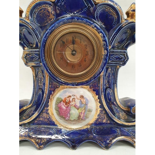 1069 - Ceramic bodied mantel clock by Royal Warwick, blue ground with gilt decoration and Arabic numerals t... 